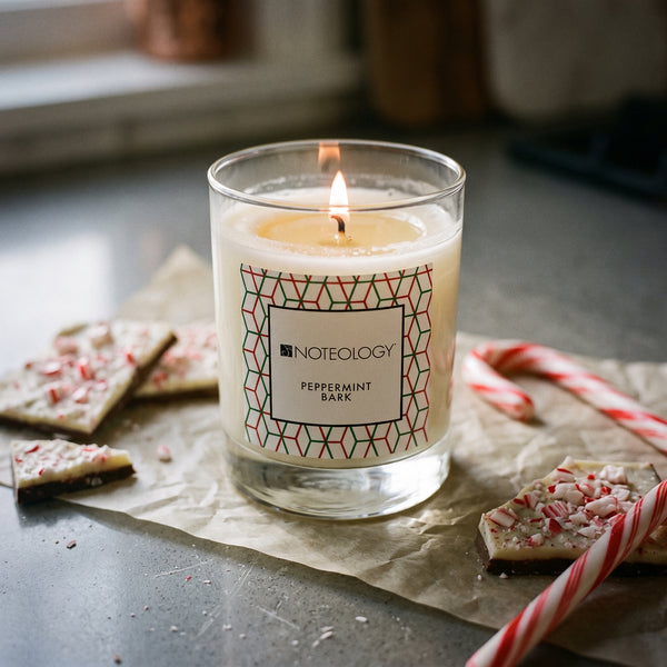 Peppermint Bark Candle burning on a grey stone kitchen counter during holiday baking | Noteology