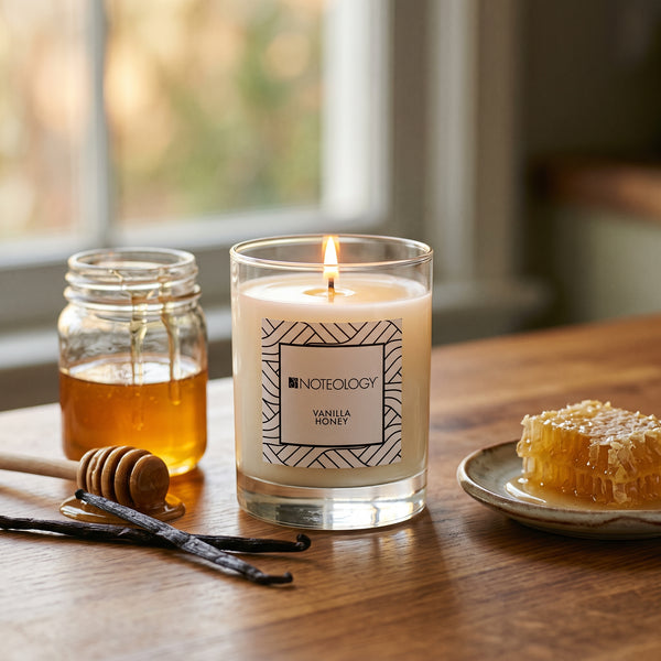 Vanilla Honey Candle burning on a kitchen table in soft window light | Noteology